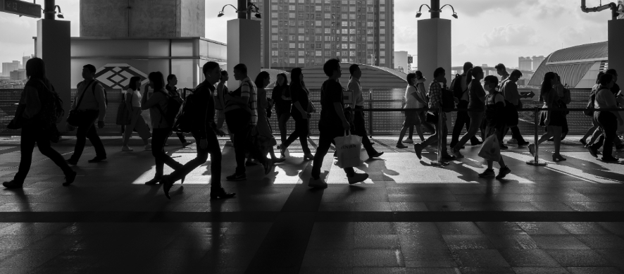 background of people walking past